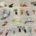Bags of hand-poured soft plastic baits in many different colors