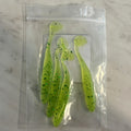 Four hand-poured chartreuse paddle tail swimbaits with green flake