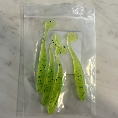 Four hand-poured chartreuse paddle tail swimbaits with green flake